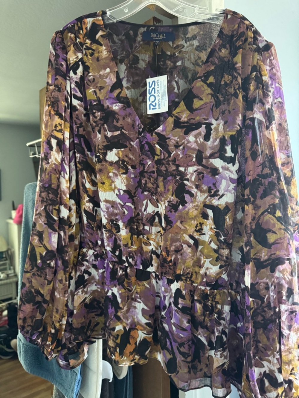 NWT Ladies dressy blouse with elastic waist and sheer sleeves.